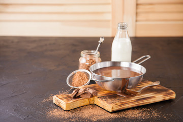 hot chocolate in a pan on a board, selective focus, copy space