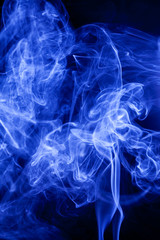 Blue smoke on a black backgroug.