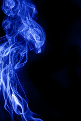 Obraz premium Blue smoke on a black backgroug.