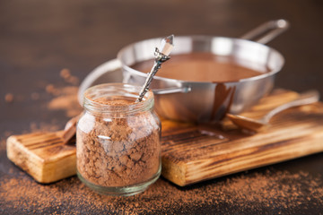 hot chocolate in a pan on a board, selective focus, copy space