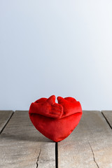 Red Heart Shape pillows on wooden background