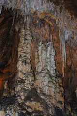 Stalactites and stalagmites in Les Grandes Canalettes grotto in French Pyrenees