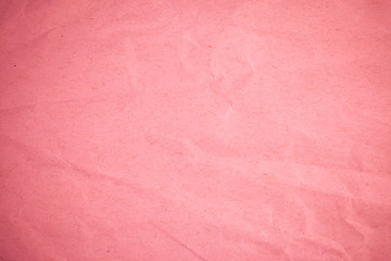 Crumpled recycle pink paper background.