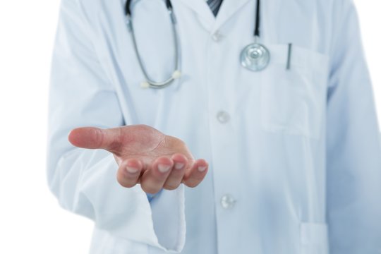Mid-section of doctor gesturing