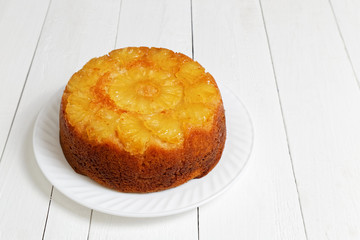 Pineapple Upside Down Cake on white wooden table