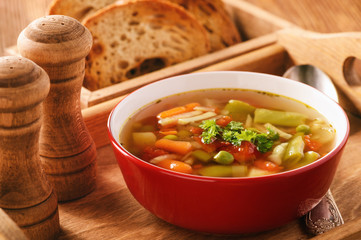 Vegetarian vegetable soup on wooden tray.