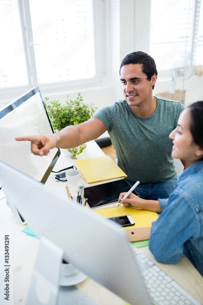 Aufkleber graphic designers working over computer