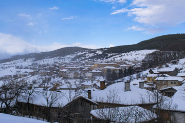 Cloudy winter mountain village 