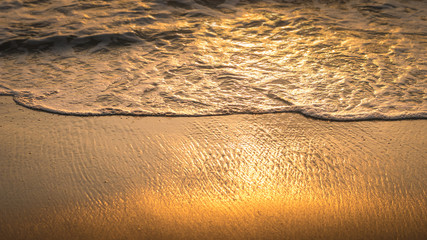 Gentle Wave Rolling over Sandbeach in Sunset light, Beautiful Crystal Bay, Nusa Penida Bali