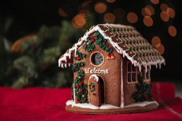 Foto auf Acrylglas Christmas gingerbread house decorated inscription Welcome © Drobot Dean