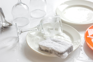 Fototapeta na wymiar concept of woman washing dishes on white background