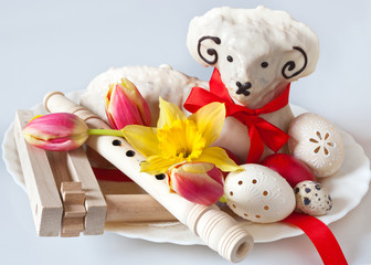 Traditional Czech easter decoration - white lamb cake with tulips and daffodil, lacy white eggs,...