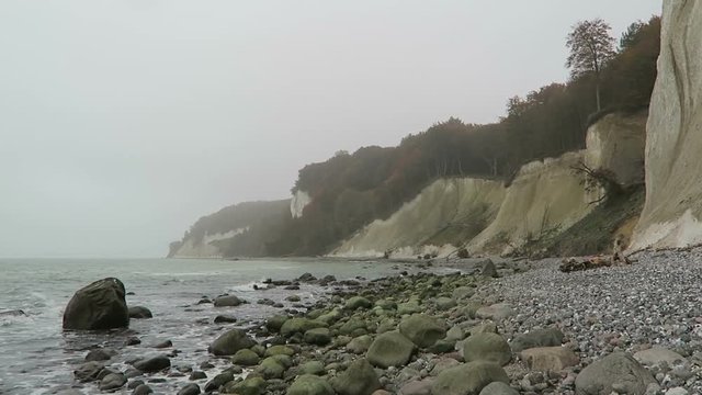 Rugen island chalk rock cliff landscape in autumn time. colorful beech tree forest. (Mecklenburg-Vorpommern, Germany). Baltic sea