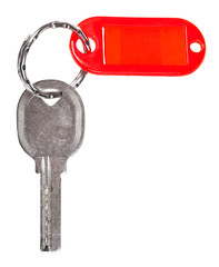 old door key with red blank keychain isolated