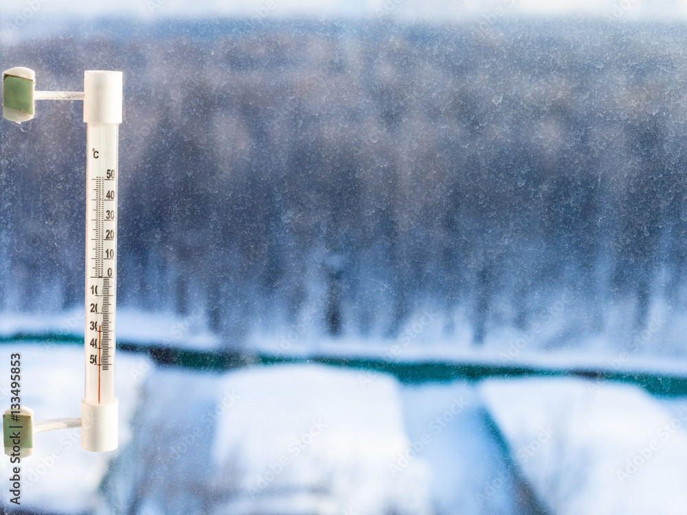 Wall mural thermometer on home window in cold winter day