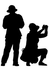 Women and man with a camera on white background