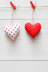 Valentine day background, pillow hearts couple on wood, copy space