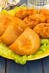 typical portuguese snack ricoes de carne and Bolinhos de bacalha