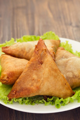 typical portuguese snack chamucas on plate