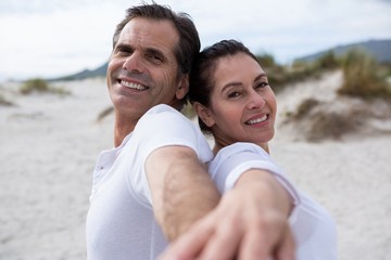 Portrait of romantic couple enjoying on beach