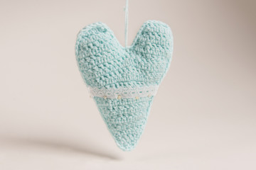 Heart knitted toys for Christmas tree, decorated with beads, lace and ribbons