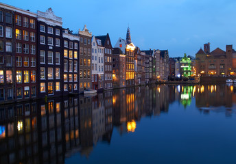 Fototapeta na wymiar Buildings on canal in Amsterdam, Netherlands