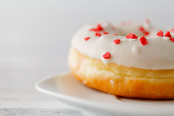 Single donut on white plate