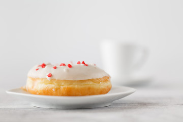 Single donut on white plate