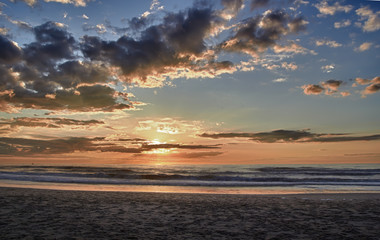 Sunset over sea with clouds