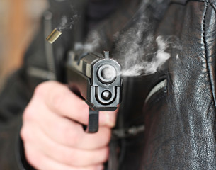 man with hand gun pistol rubber attack violence