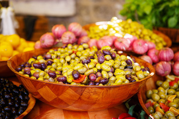 Marinated garlic and olives on provencal street market in Proven