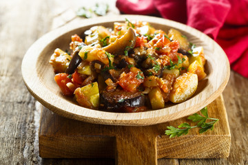 Vegetable stew in wooden bowl