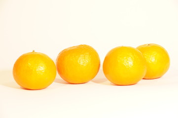 Ripe orange mandarins isolated on white background