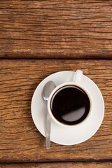 Cup of coffee on wooden table