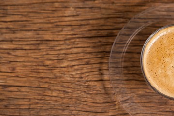 Cup of coffee on wooden table
