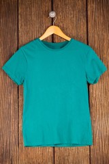Turquoise t-shirt on hanger