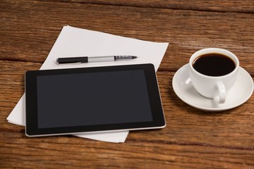 Fototapeta na wymiar Digital tablet and cup of coffee