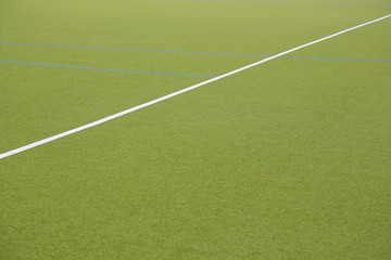 Obraz premium Weisse Linie auf einen Kunstrasen - Spielfeld Feldhockey, Icon, Konzept, Raum für Text