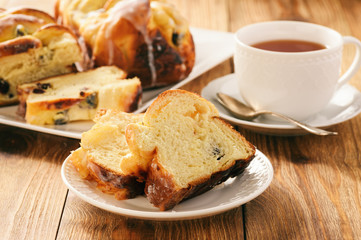Braided sweet brioche with cheese and dried cranberries.