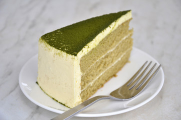 Green tea cake on table