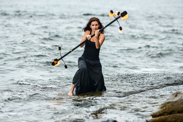 play with fire show on the shore of the sea