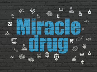 Healthcare concept: Miracle Drug on wall background