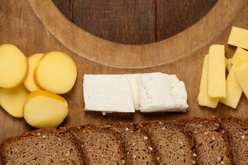 Slices of brown bread and variety of cheese