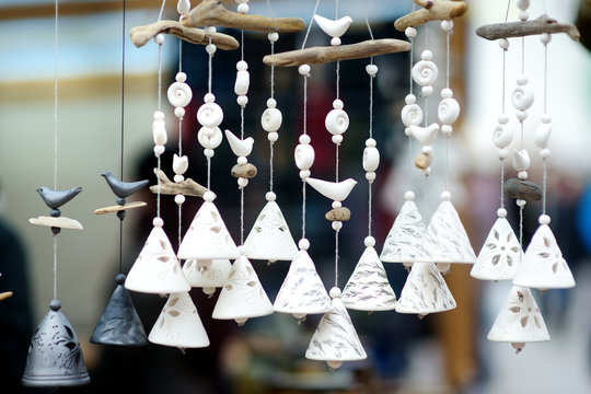 Cute white ceramic bells sold on Easter market in Vilnius, Lithuania