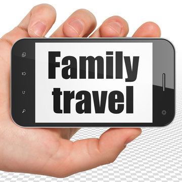 Travel concept: Hand Holding Smartphone with Family Travel on display