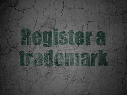 Law concept: Register A Trademark on grunge wall background