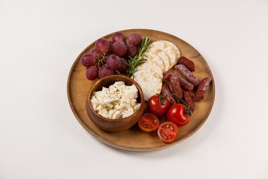 biscuits, cherry tomatoes, grapes, bowl of cheese