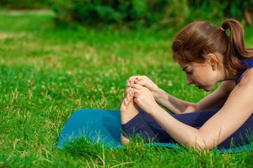 Young woman doing yoga exercise on mat 14