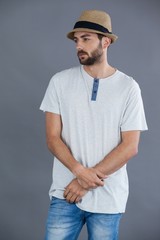 Man in white t-shirt and fedora hat 