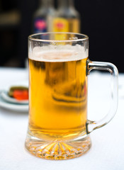 Cold glass of beer on the table.